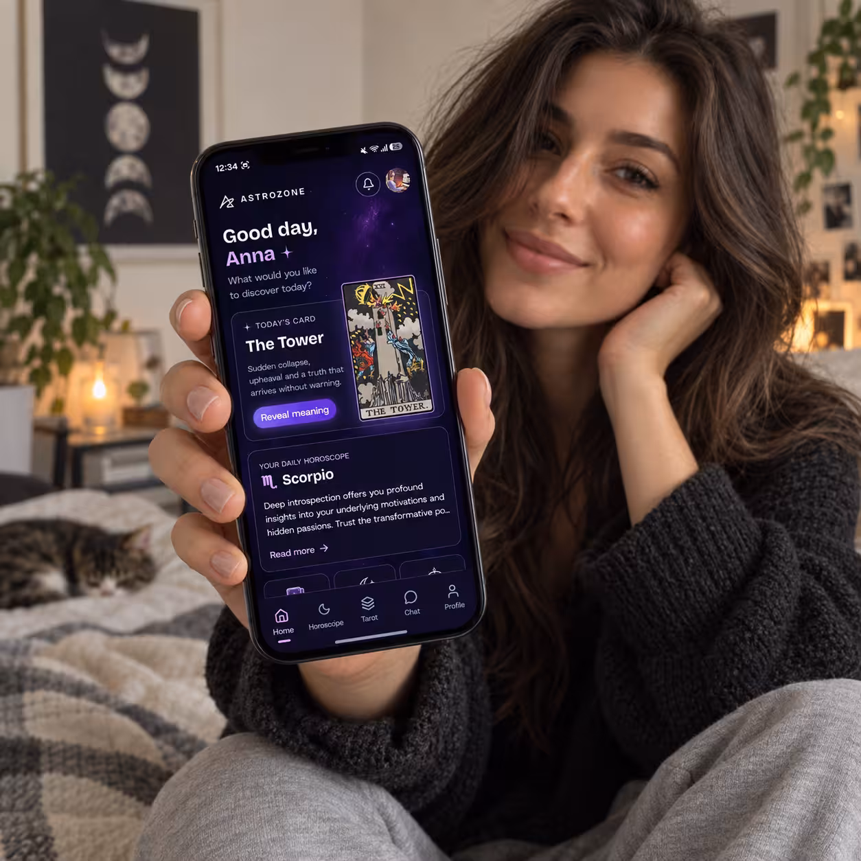 The AstroZone mobile app showing today's message, card and horoscope on a phone